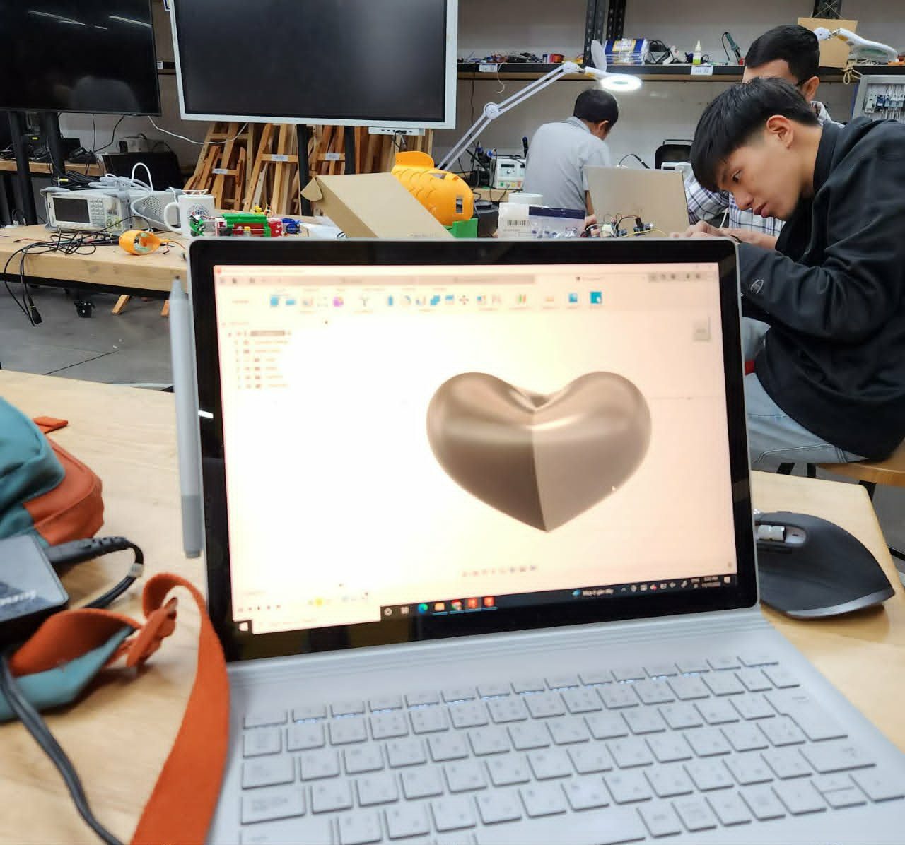 A 3D-modeled heart shape on a laptop screen in the engineering lab