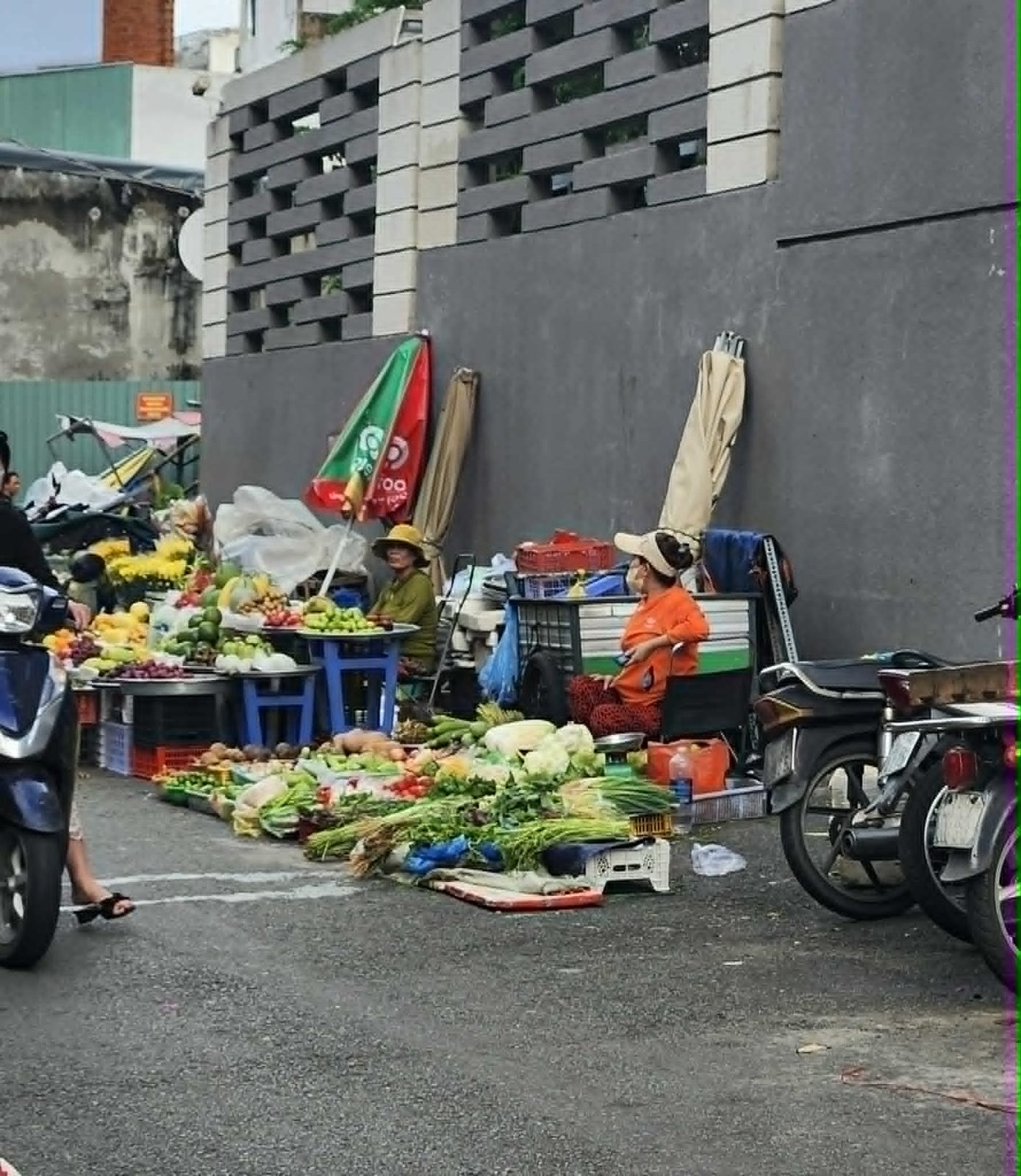 Street vendors and their produce on a Ho Chi Minh City sidewalk, part of ethnographic fieldwork