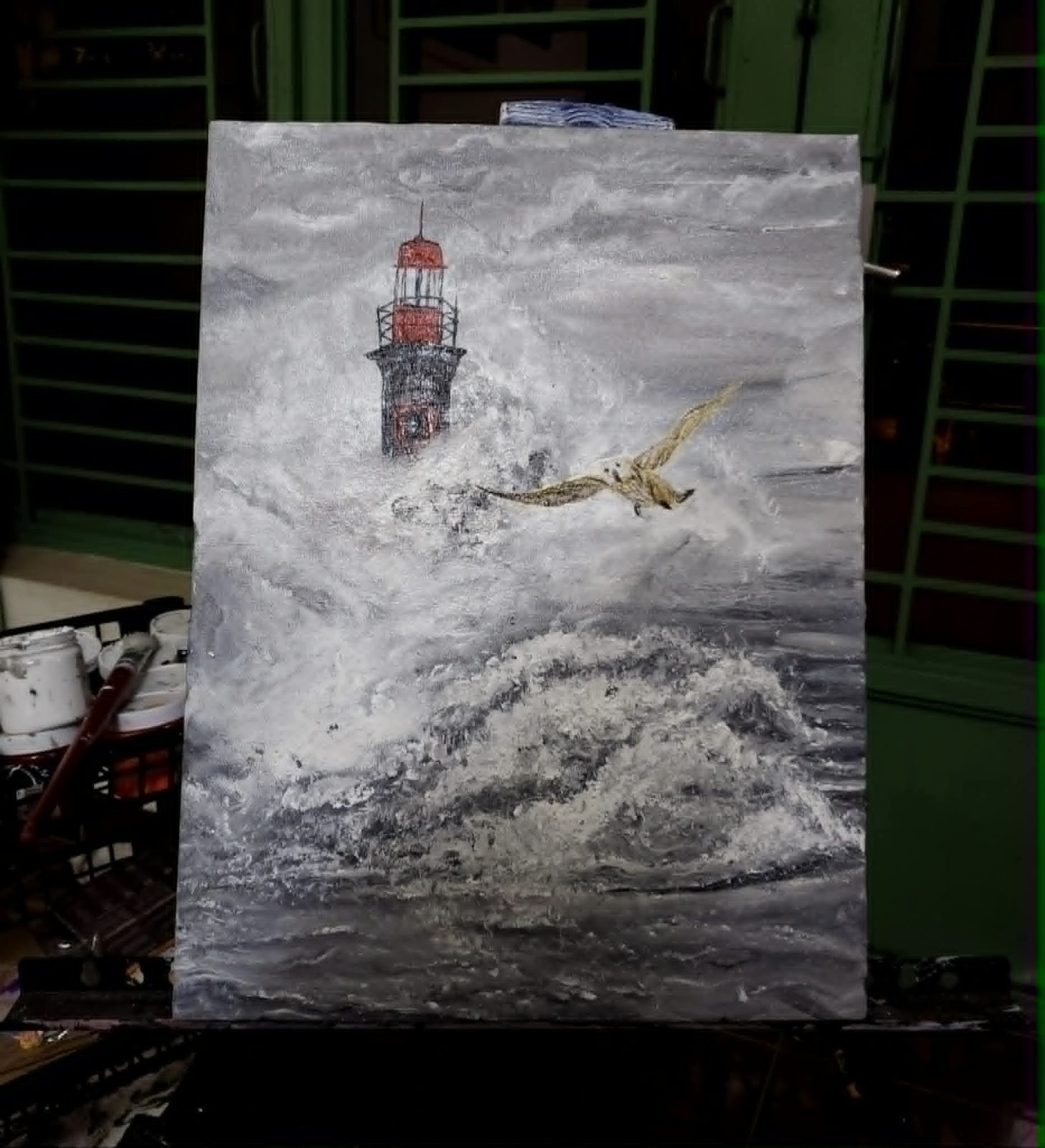 Acrylic painting of a lighthouse and a seabird over rough grey seas