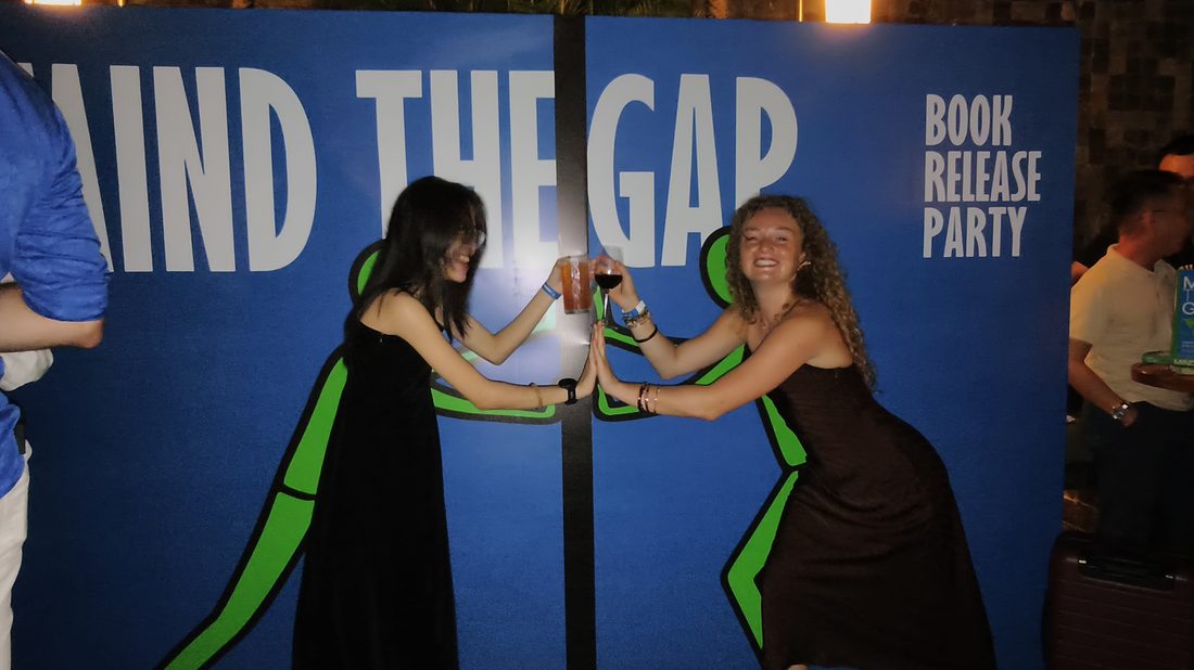 Guests posing with the Mind The Gap book
