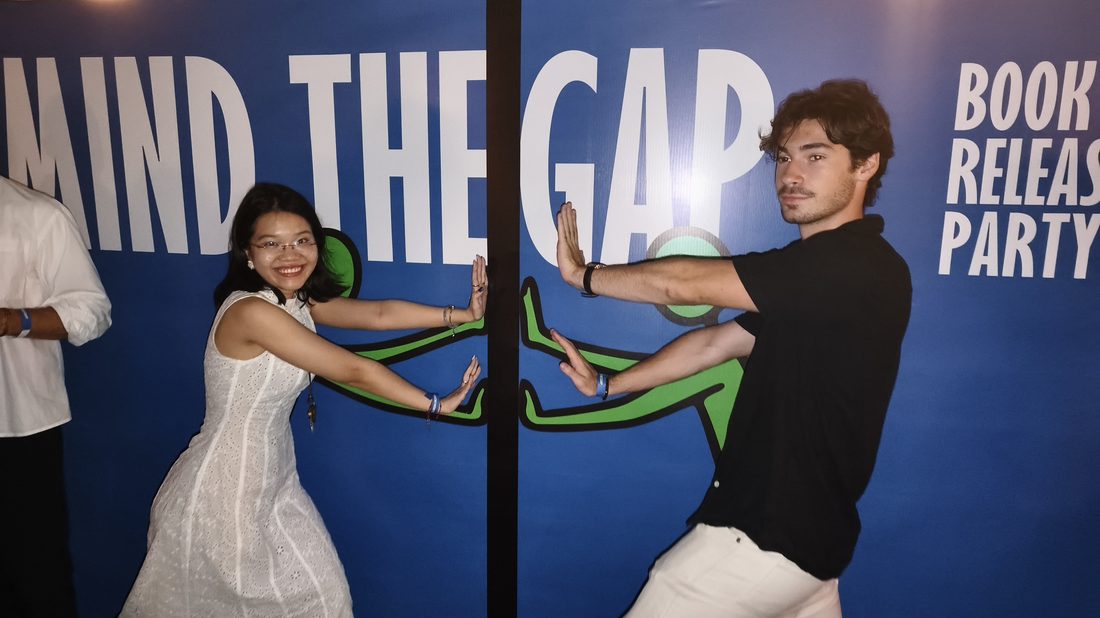 Guests mingling at the Mind The Gap rooftop launch