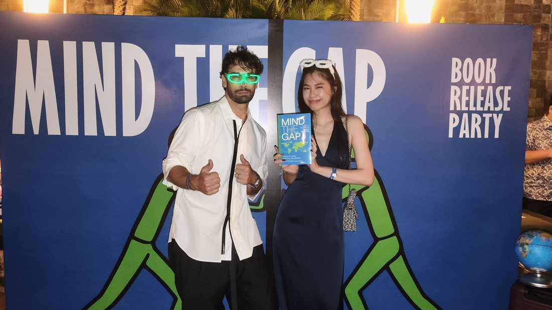 Guests posing with the Mind The Gap book
