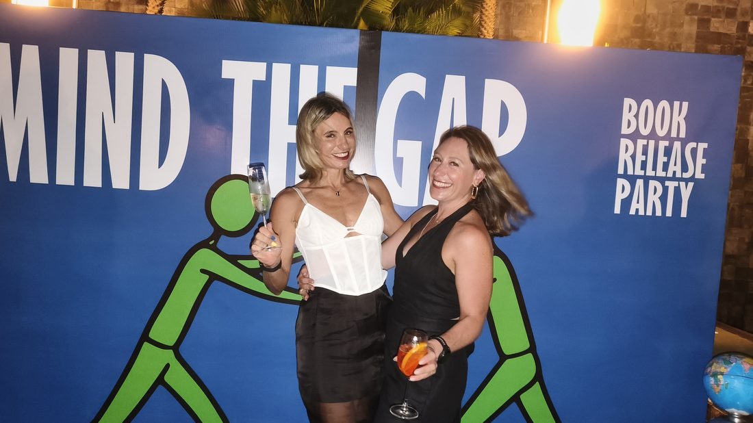 Guests celebrating the Mind The Gap book launch