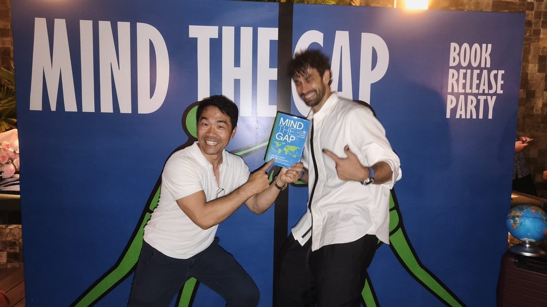 Guests posing at the Mind The Gap book release party