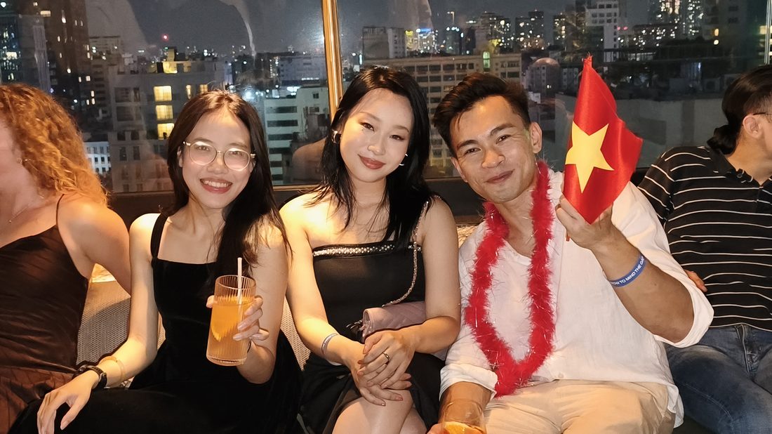 Anne with guests at the Mind The Gap rooftop event